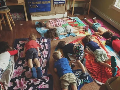 a group of children on a rug