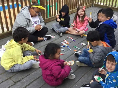 a group of children sitting on the ground