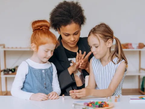 a group of children looking at a paper