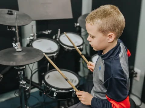 a boy playing drums