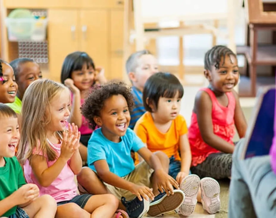 a group of children sitting in a circle