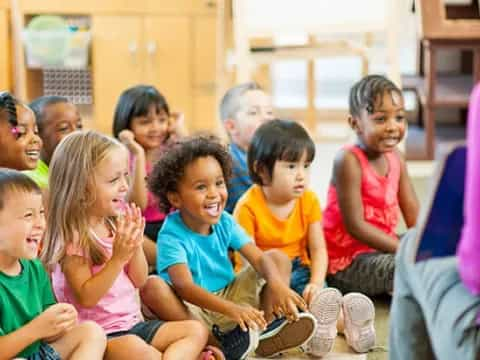 a group of children sitting in a circle