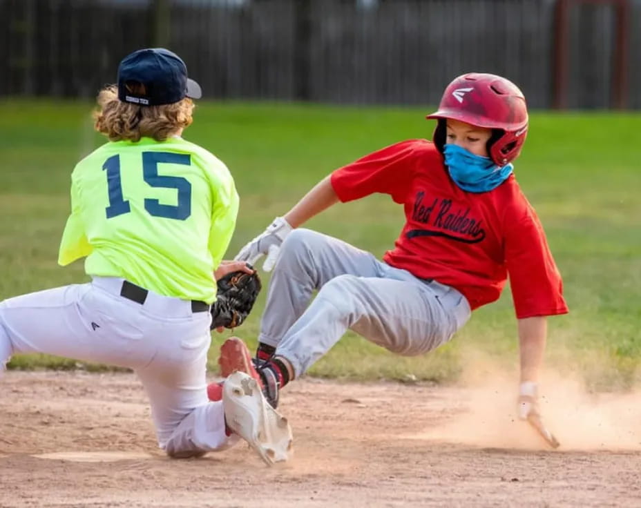 a couple of women playing baseball