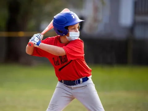 a young boy playing baseball