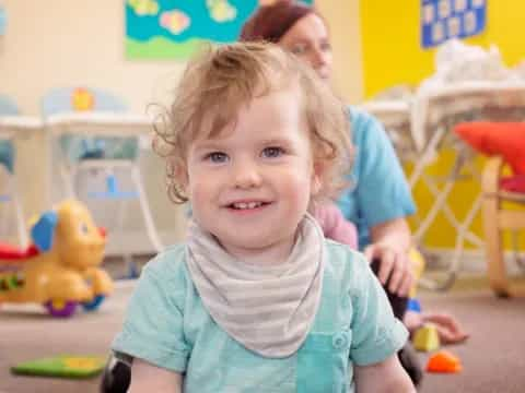 a child smiling at the camera