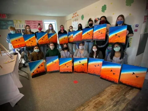 a group of people in a room with colorful toys