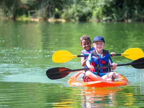 two kids in a canoe