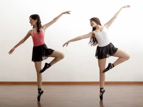 two women dancing on a stage