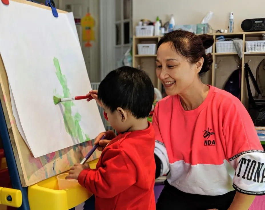 a man and a child painting