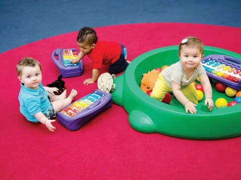 children playing in a ball pit