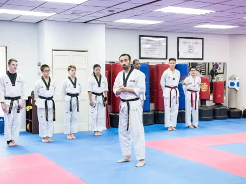 a group of people in karate uniforms