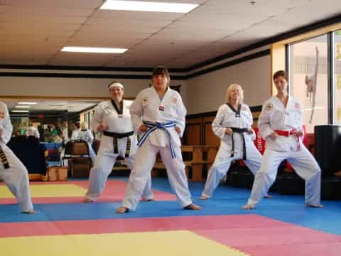 a group of people in karate uniforms