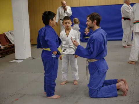 a group of people in blue karate uniforms