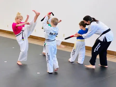 a group of people in karate uniforms