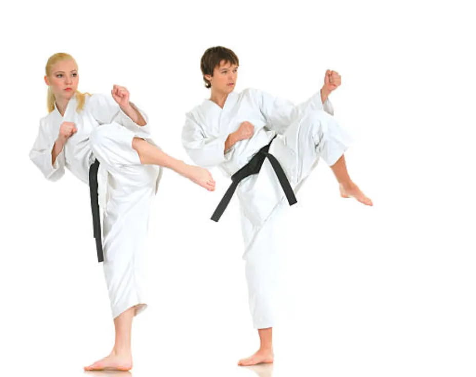 a group of people in karate uniforms