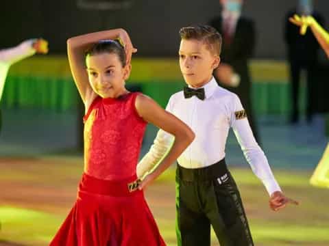 a boy and girl dancing