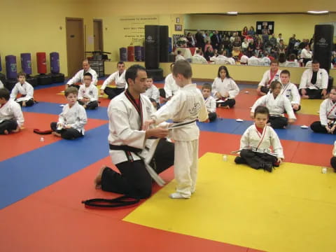 a group of people in karate uniforms