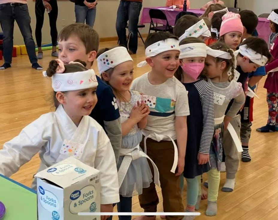 a group of children wearing clothing