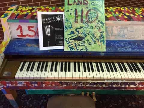 a piano with a sign on it