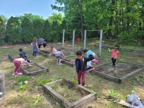 a group of people working in a garden