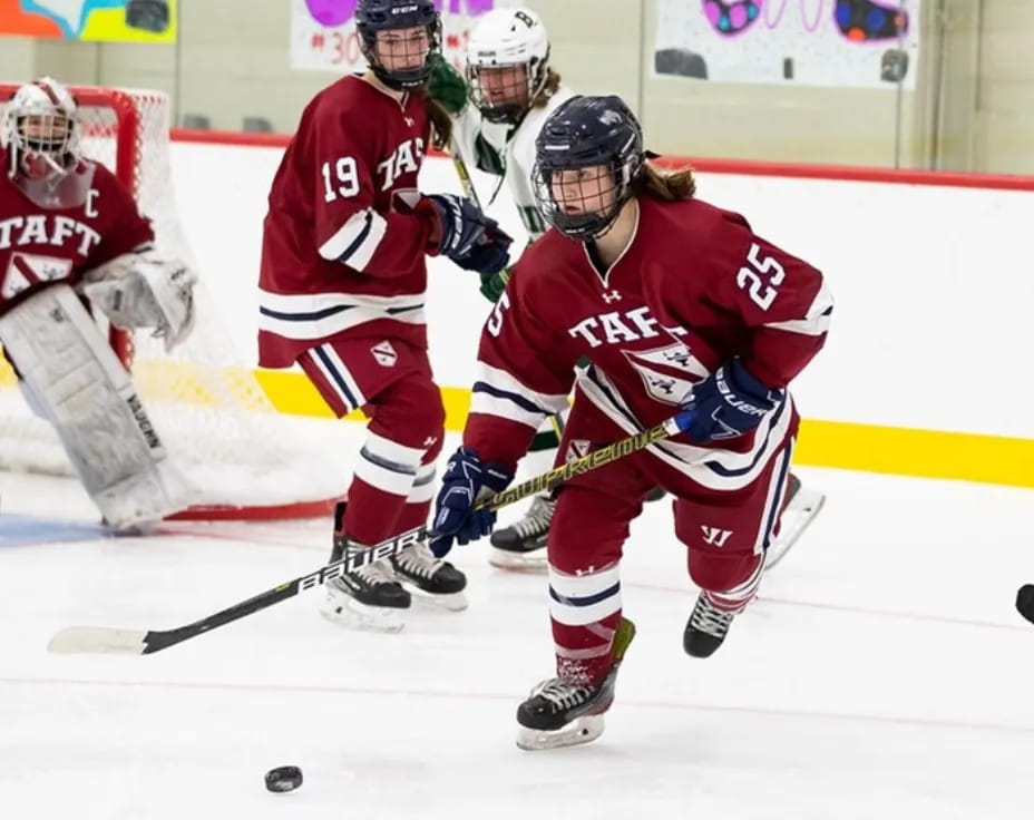 a group of people playing hockey