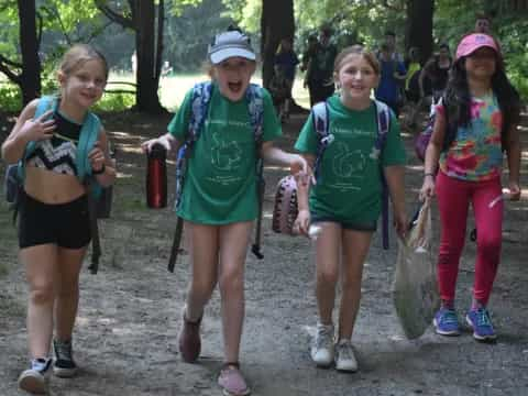 a group of girls in a forest