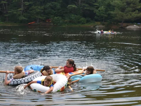 a group of people on a raft in a lake