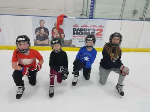 a group of kids wearing hockey gear