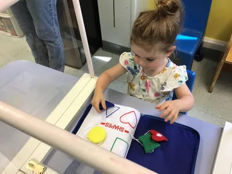 a child coloring on a book