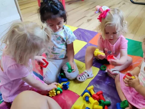 a group of children playing with toys