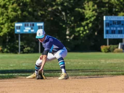 a baseball player kneeling on the ground