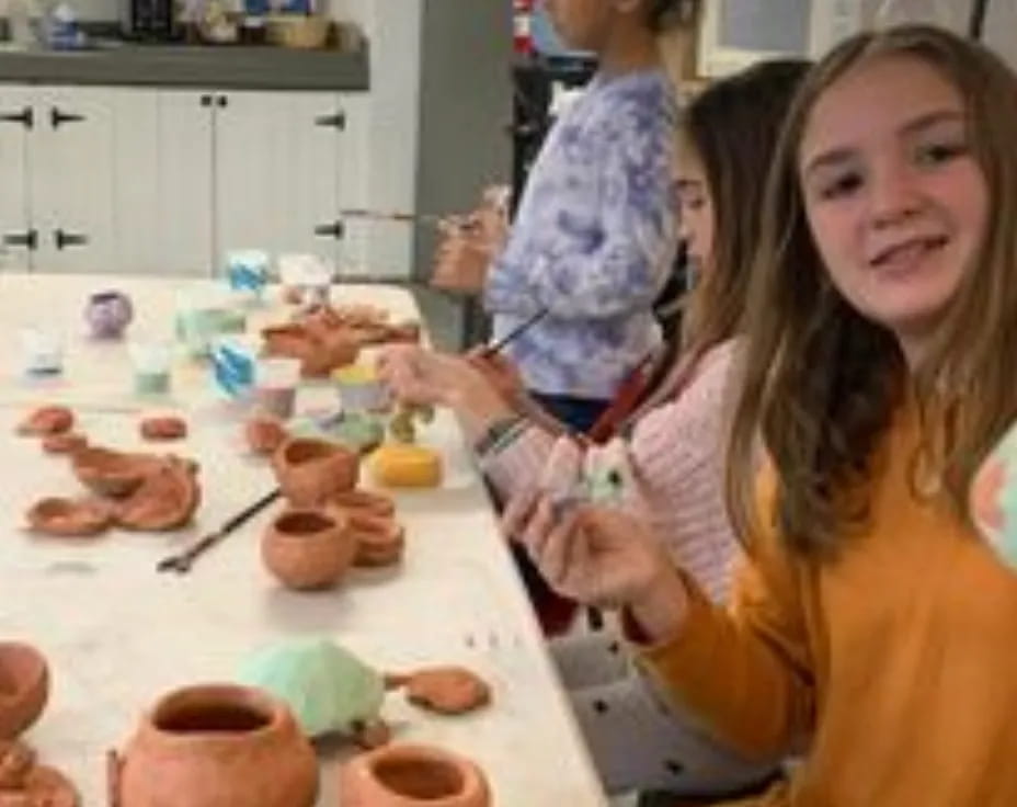 a person and a child in a kitchen