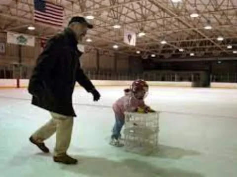 a person and a child ice skating