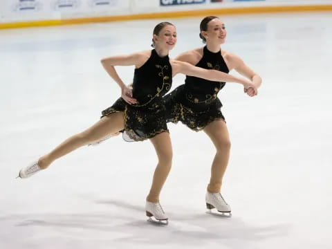 two women ice skating