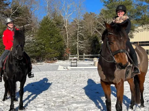 a couple of people ride horses