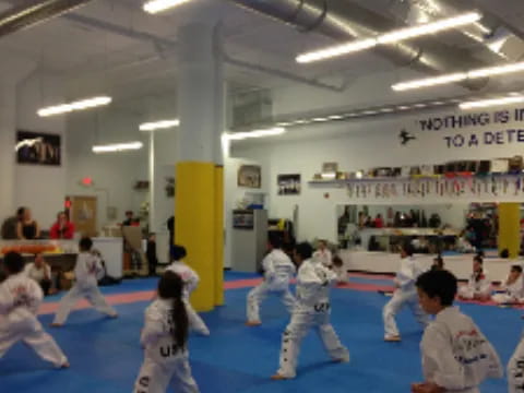 a group of people in karate uniforms