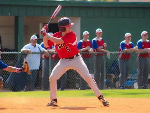 a baseball player swinging a bat