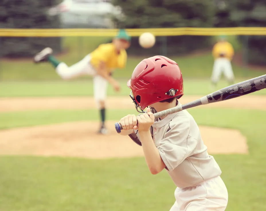 a young boy playing baseball