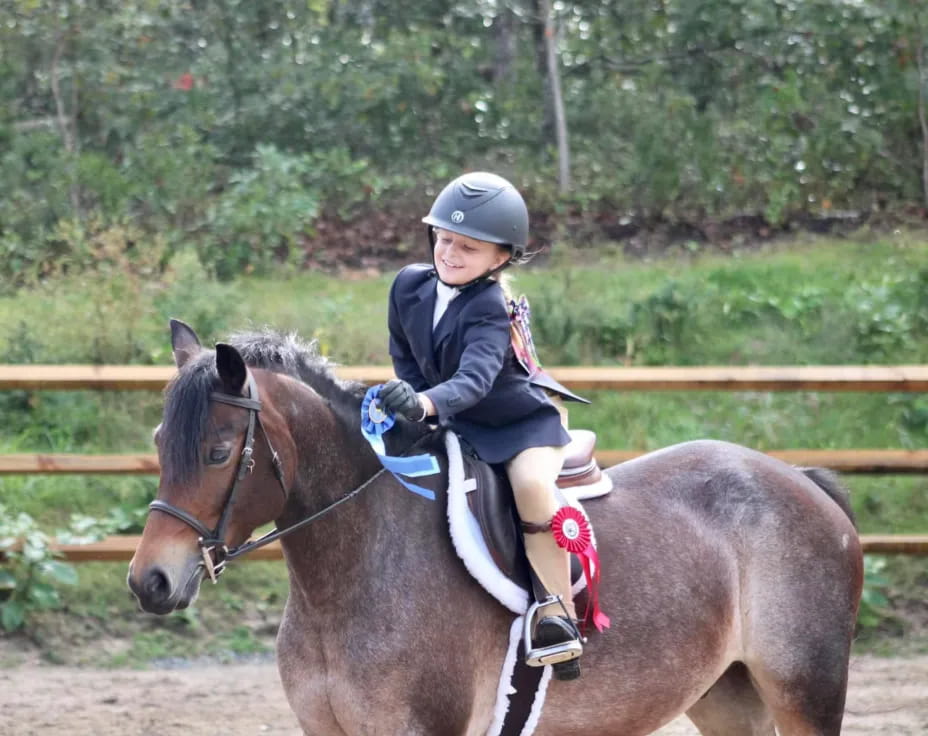 a girl riding a horse