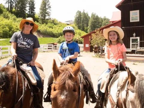 a group of people ride horses