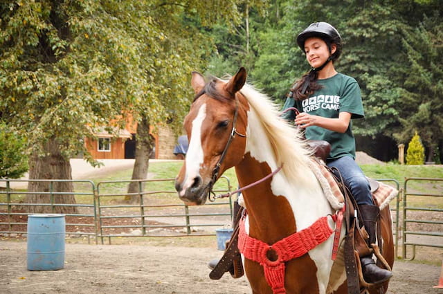 a girl riding a horse