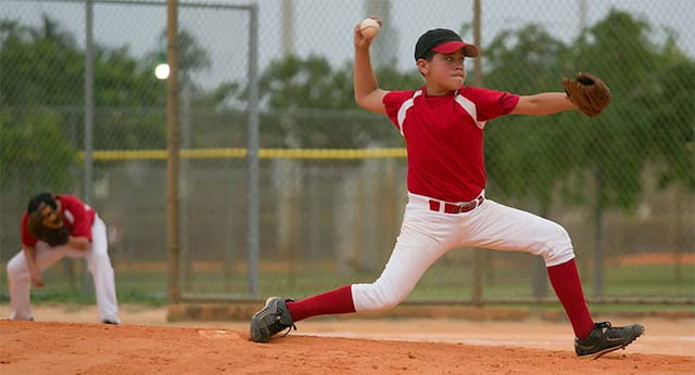 a baseball player throwing a ball