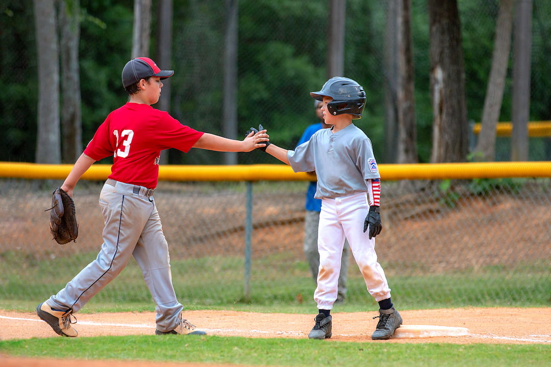 a couple of kids playing baseball