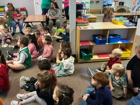 a group of children sitting on the floor