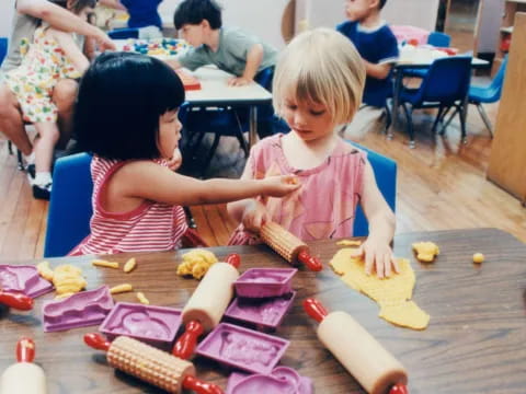 a couple of children playing with toys