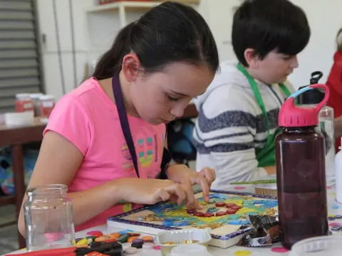 a person and a child painting