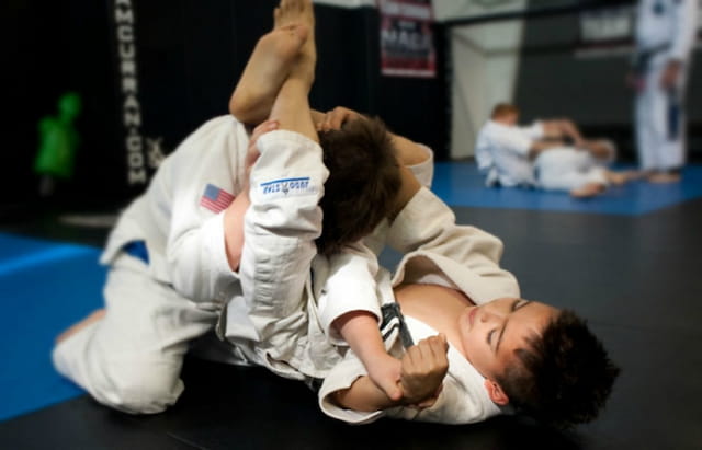 a man and a woman in karate uniforms