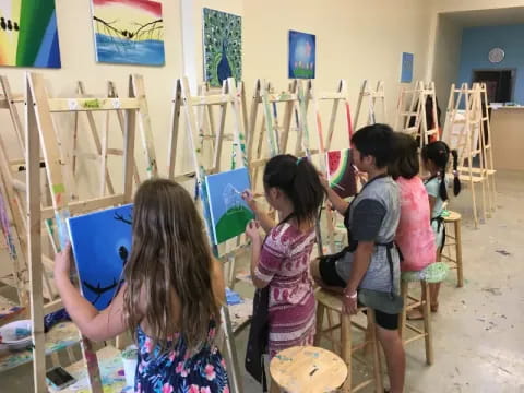 a group of children painting