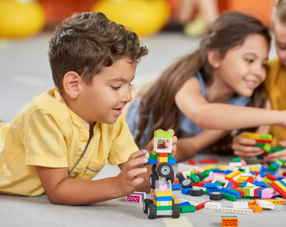 a group of children playing with toys