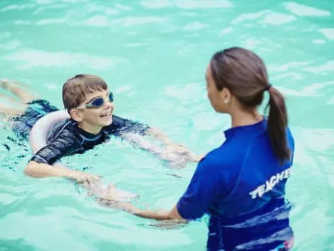 a person and a boy in the water